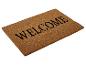 Un paillasson brun avec l'inscription 'Welcome'