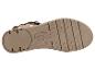 Semelle de sandale femme beige avec détails de boucle métallique.