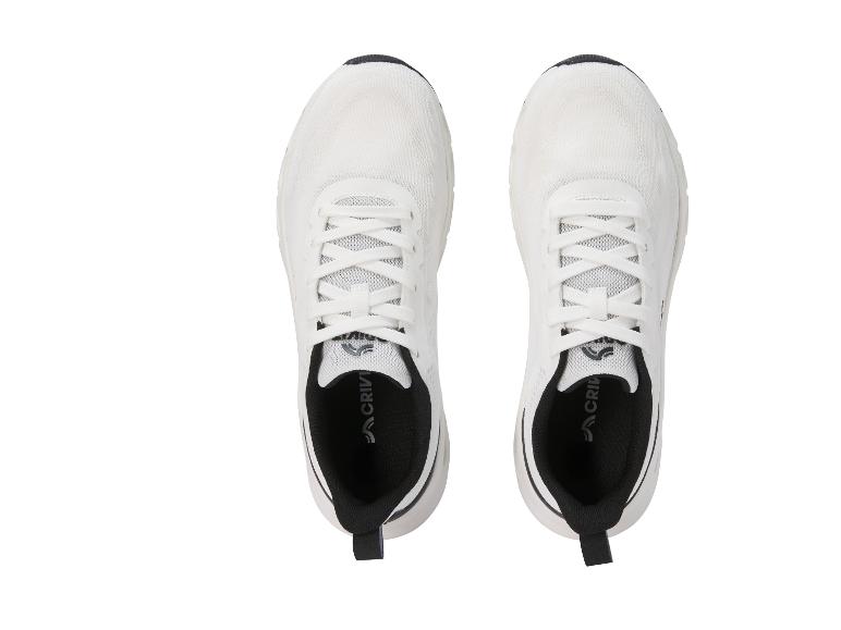 Une paire de chaussures de sport blanches avec des détails noirs, vues du dessus.