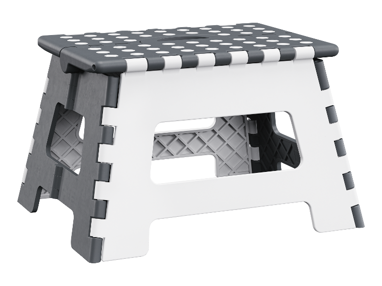 Un tabouret pliable gris et blanc à pois.