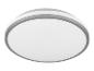 Un plafonnier rond et blanc avec une bordure argentée.