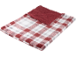 Couverture à carreaux rouges et blancs avec doublure en peluche douce.