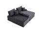 Canapé modulaire gris en velours côtelé avec coussins, pour salon.