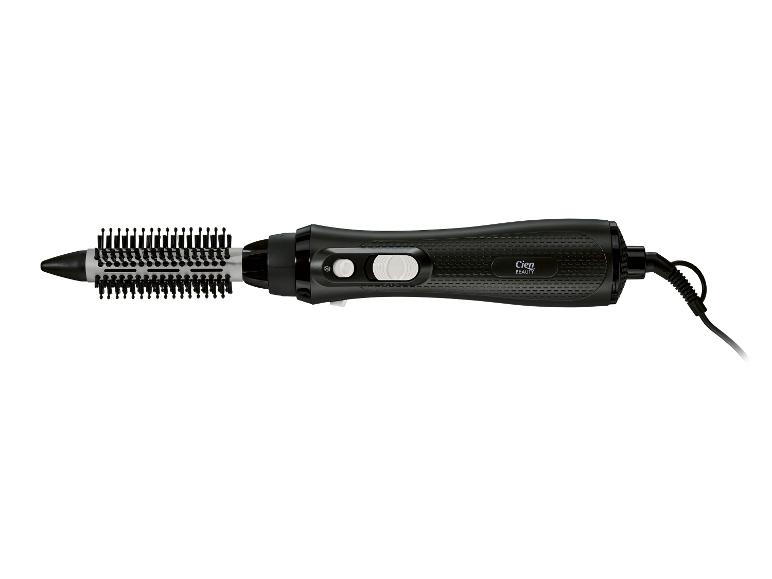Brosse soufflante noire avec poils et cordon.