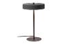 Lampe de table noire avec une base et un abat-jour ronds.