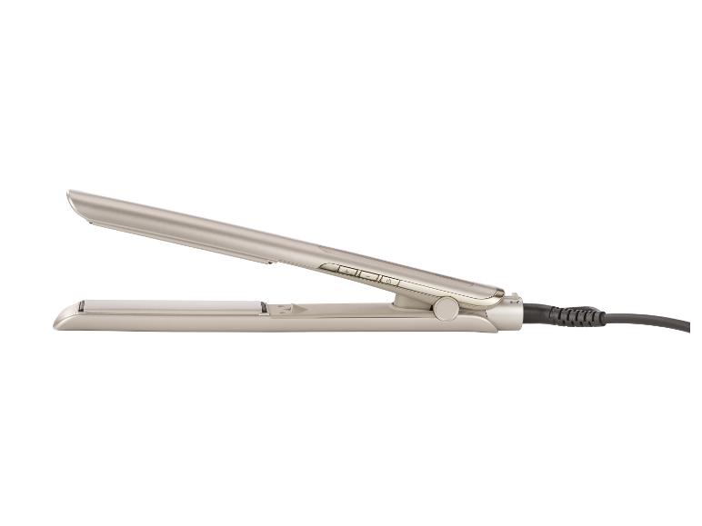Un fer à lisser beige avec des boutons de commande et un cordon noir.