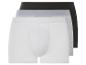 Trois boxers en blanc, gris et noir.