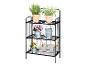 Étagère métallique noire à trois niveaux avec herbes, fleurs et outils de jardinage.