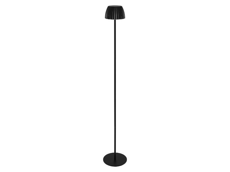 Lampadaire noir avec un abat-jour plissé et une base ronde.