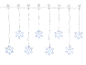 Guirlande lumineuse flocon de neige avec ventouses sur fond noir.