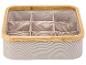 Boîte de rangement en tissu beige avec cadre en bambou, compartiments intérieurs.