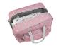 Sac rose à pois pour machine à coudre avec une machine à coudre à l'intérieur