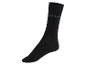 Une chaussette noire avec le logo Saturday.