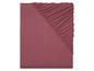 Un drap-housse en jersey rose.