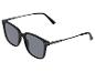 Lunettes de soleil noires avec verres gris et fines branches métalliques.