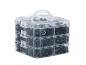 Une boîte transparente avec différents clips en plastique noirs.