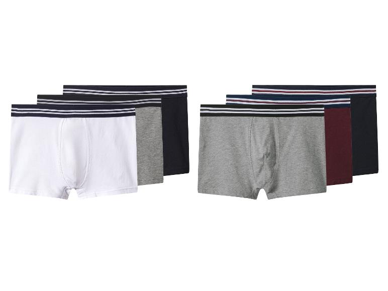 Lot de boxers pour hommes en couleurs assorties avec des bandes élastiques rayées.