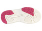 La semelle d'une sneaker blanche avec des accents roses.