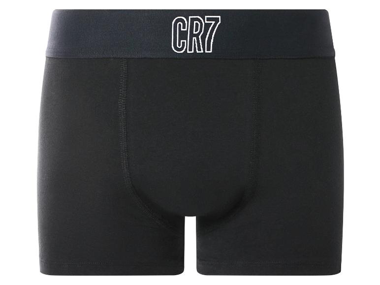 Caleçon noir avec un élastique à la taille affichant un logo blanc.