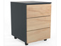Une armoire gris foncé avec trois tiroirs sur roulettes, en bois.