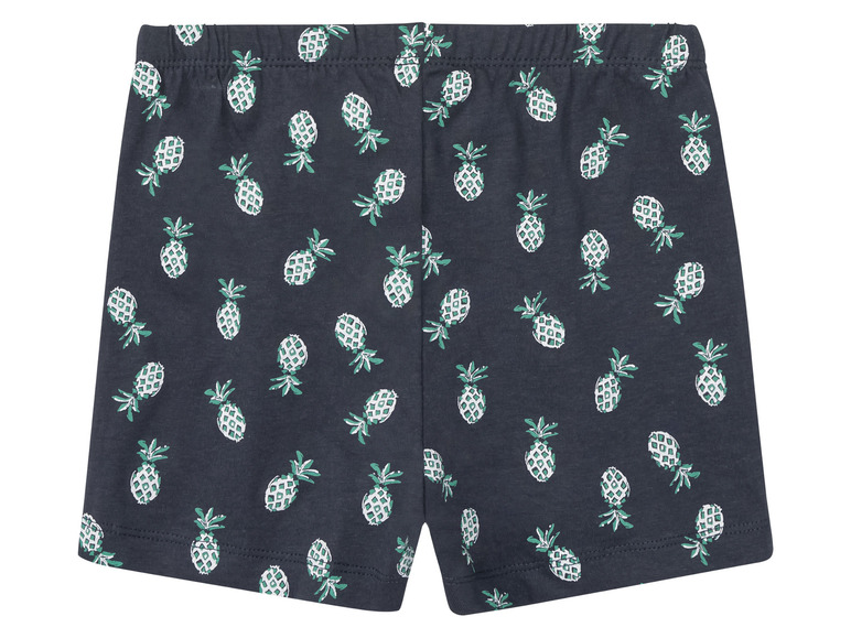 Short bleu marine à imprimé ananas.