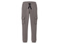 Pantalon de survêtement gris avec des poches cargo.