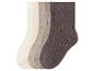 Cinq paires de chaussettes côtelées dans différentes nuances de marron, du beige clair au marron foncé.
