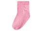 Une chaussette rose pour enfant avec une texture côtelée.