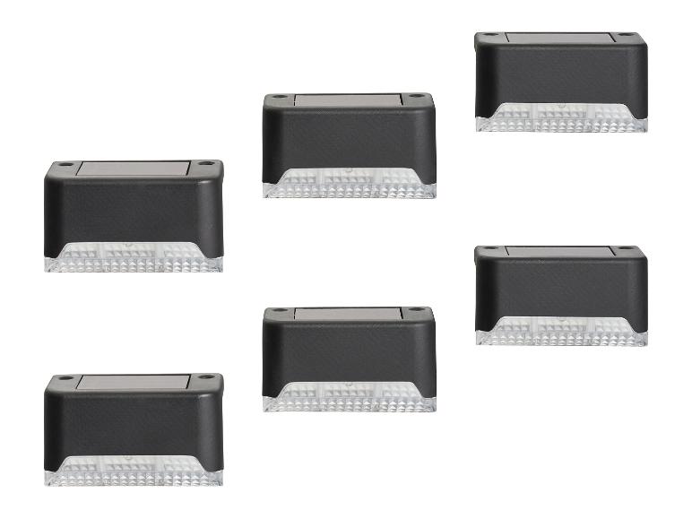 Six lampes solaires extérieures noires avec surface texturée et lentille striée.