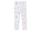 Leggings blanches avec un motif d'unicornes et d'étoiles.