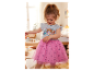 Petite fille portant une robe rose en tulle à imprimé Pat' Patrouille.