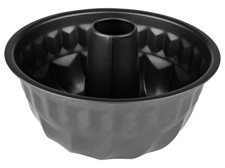 Un moule à gâteau de couleur foncée et ondulé.