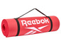 Un tapis de yoga rouge Reebok avec sangle.
