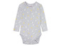 Un body bébé gris à pois jaunes et blancs de Lupilu.