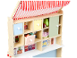 Magasin de jouets en bois avec un auvent rayé rouge et blanc, des tiroirs et des étagères remplis de nourriture factice.