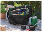 Sac isotherme et thermos Parkside sur une table en bois en extérieur.