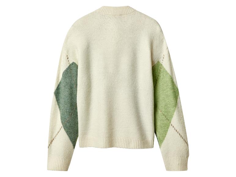 Pull argyle crème avec des motifs verts et vert foncé.