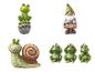 Figurines de jardin avec des grenouilles, un escargot et un gnome avec une pancarte 'Bienvenue'.