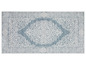 Un tapis bleu avec un motif blanc en filigrane.