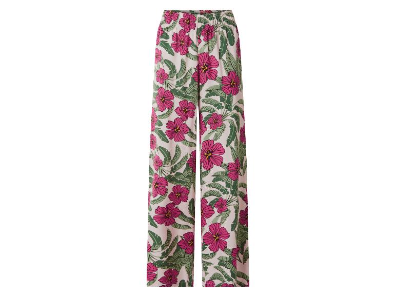 Pantalon large femme à motif tropical d'hibiscus roses et de feuilles vertes.