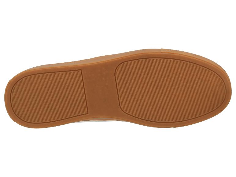La semelle d'une sneaker en caoutchouc marron.