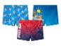 Trois maillots de bain pour enfants : bleu avec des chiens, bleu avec des chiots et rouge-bleu avec Spider-Man.