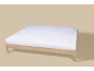 Drap-housse à motif flocons de neige sur un cadre de lit en bois