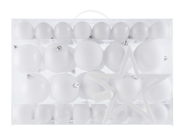 Boîte de décorations de Noël blanches, incluant des boules et une étoile.