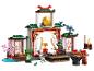Ensemble LEGO Ninjago avec temple, gong, figurines et accessoires d'entraînement.