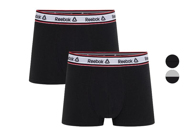 Deux boxers Reebok noirs avec ceinture blanche et rouge