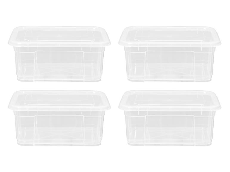 Quatre boîtes de rangement rectangulaires en plastique transparent avec couvercles, disposées en deux rangées.