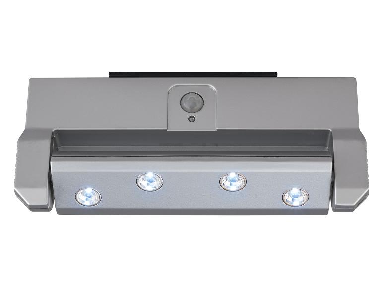 Lampe argentée avec capteur de mouvement et quatre LED.