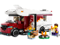 Camping-car jouet avec figurines, feu de camp et accessoires.
