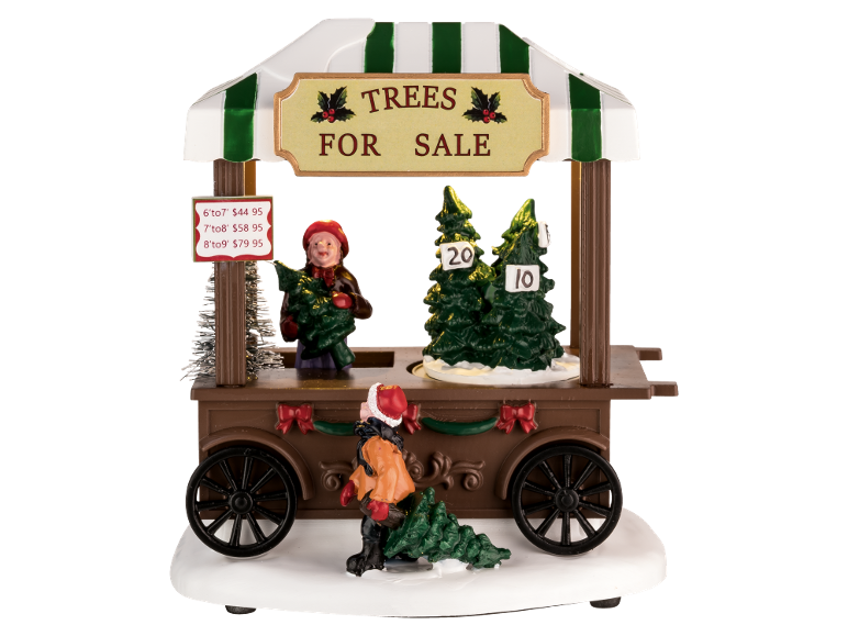 Stand de vente de sapins de Noël avec figurines et prix pour différentes tailles.